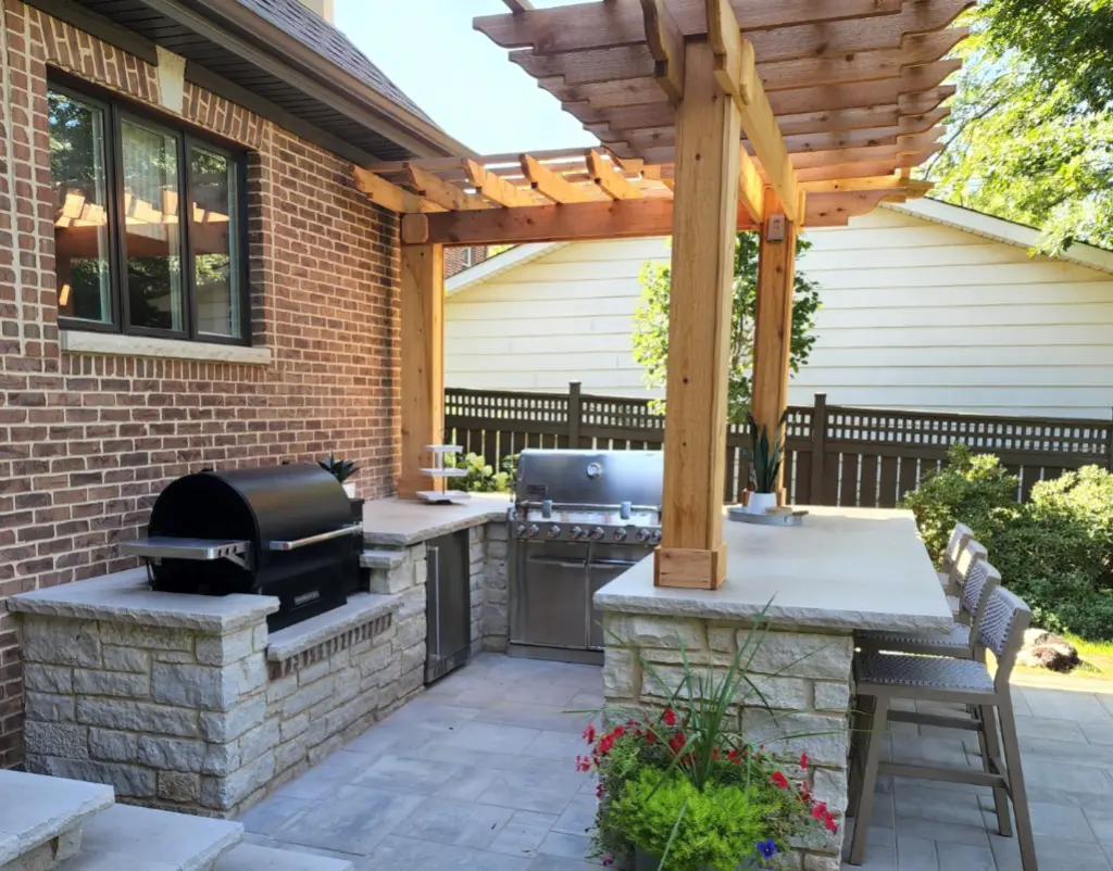 Natural stone outdoor kitchen, bar and paver patio in Arlington Heights, Illinois
